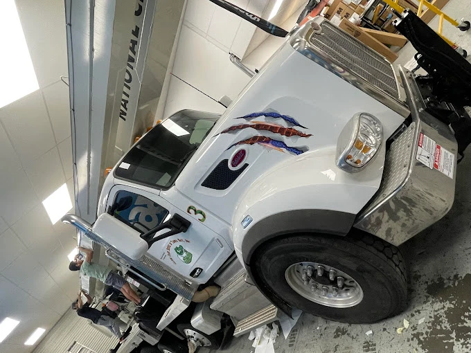 Personalized vehicle decals and lettering for construction companies in Tampa, FL. Enhance your brands visibility on every job site.