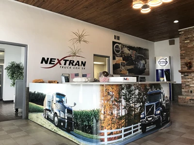 Custom Office Signs Transforms Nextran Truck Center’s Lobby